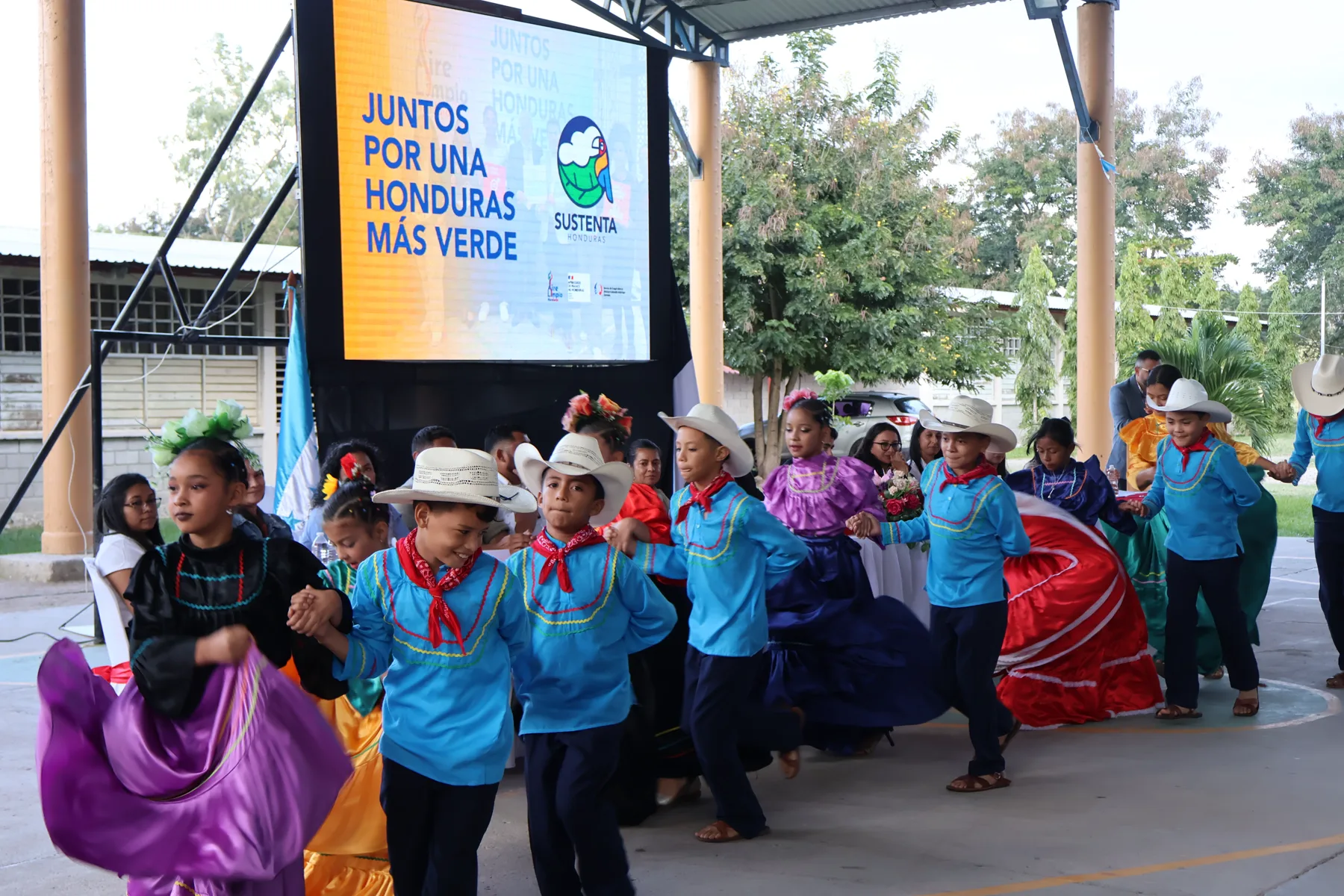 Young students participating in a community environmental activity.